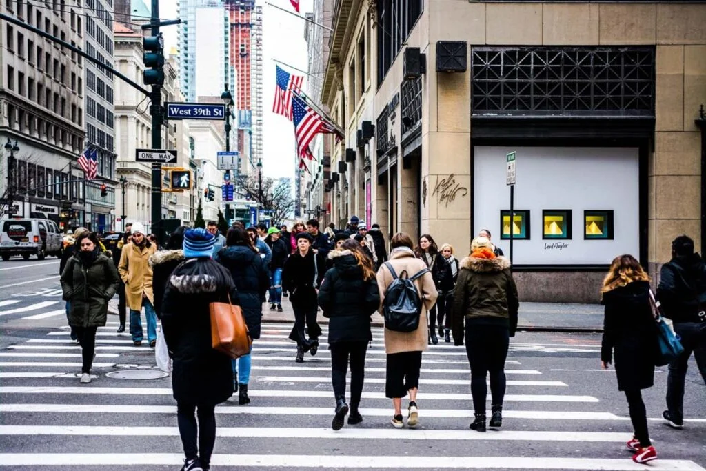 People crossing the street on 5th Avenue in Manhattan, New York City - Behind the Scenes NYC